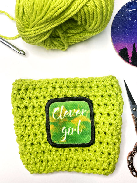 Clever Girl Dino Park reusable crochet coffee cozy